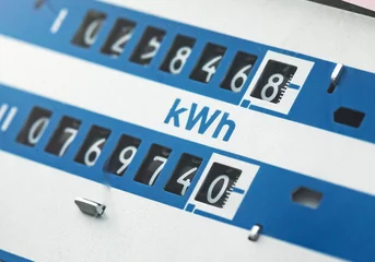 Fotobehang Home electricity meter. An electric meter for use in a home appliance with copied space. It is a modern technology that can monitor electricity consumption. © murmakova