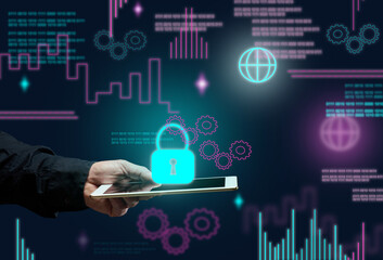 male hand holds an electronic tablet and a padlock sign on a dark background. Data protection concept, database hacking. Internet security