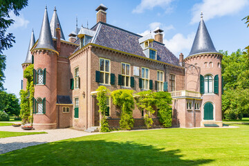 The back view of a castle with beautiful towers in a park in Lisse, the Netherlands