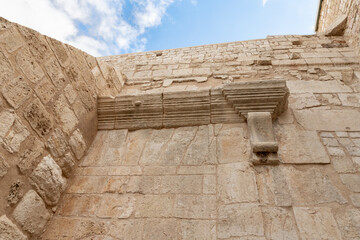 Part  of the stone wall above the entrance to Church of Nativity on central Manager Square Street...