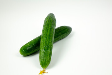 Fresh green cucumber isolated on white background