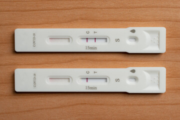 Two antigen rapid test devices for coronavirus covid-19 shows positive and negative result