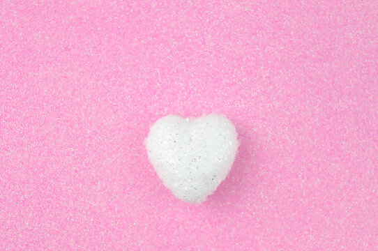 White heart on pink background love concept 