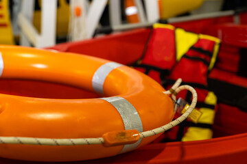 Orange Lifebuoy in front of boat