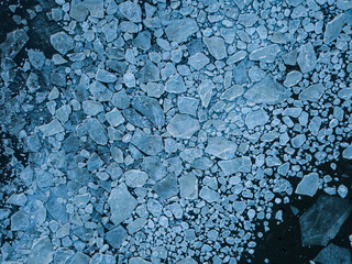 Aerial drone view on ice floes on ocean surface in Norways arctic sea