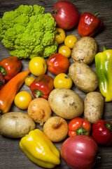 Vegetables on a wooden background. Dietary nutrition.
