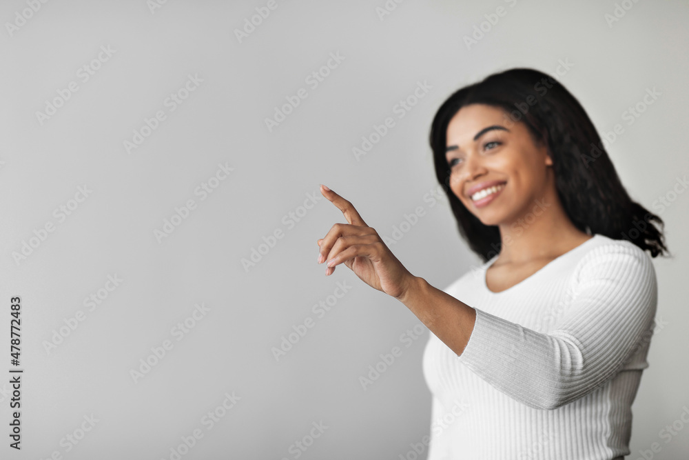 Poster iot technologies concept. excited millennial black lady pointing finger in the air pushing button on