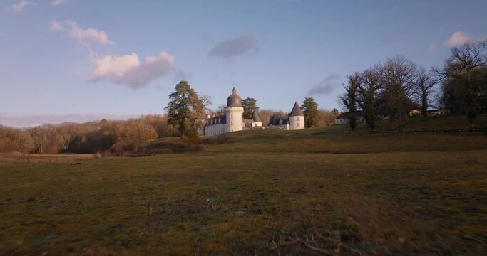Aerial shot of the castle of the Gu&eacute; P&eacute;an by sunset in Monthou-sur-Cher, next to the Loire Valley, in France.