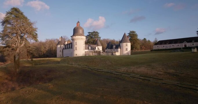 Aerial shot of the castle of the Gu&eacute; P&eacute;an by sunset in Monthou-sur-Cher, next to the Loire Valley, in France.