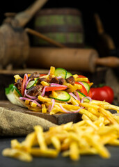 Greek gyros wrapped in pita bread on a wooden board