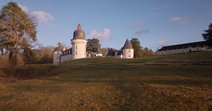 Aerial shot of the castle of the Gu&eacute; P&eacute;an by sunset in Monthou-sur-Cher, next to the Loire Valley, in France.