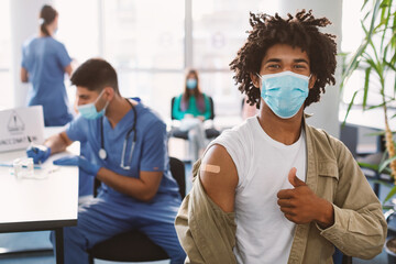 Happy Black Guy In Mask Showing Thumbs Up After Vaccine
