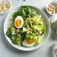 Healthy green salad with cashew and hard boiled eggs	