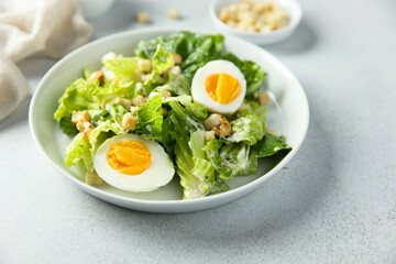 Healthy green salad with cashew and hard boiled eggs	