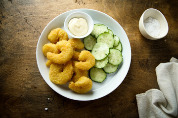 Deep fried shrimps with cucumber salad