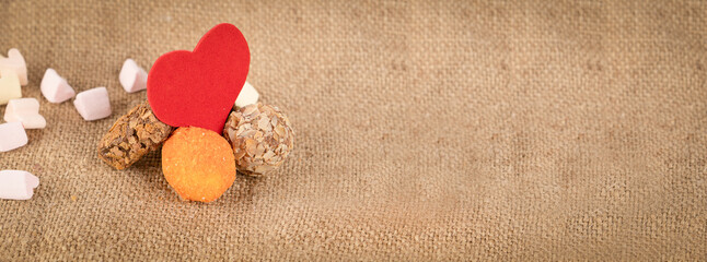 Praline candies and marshmallow on background. Group of different sweets. Round dessert. Delicious...