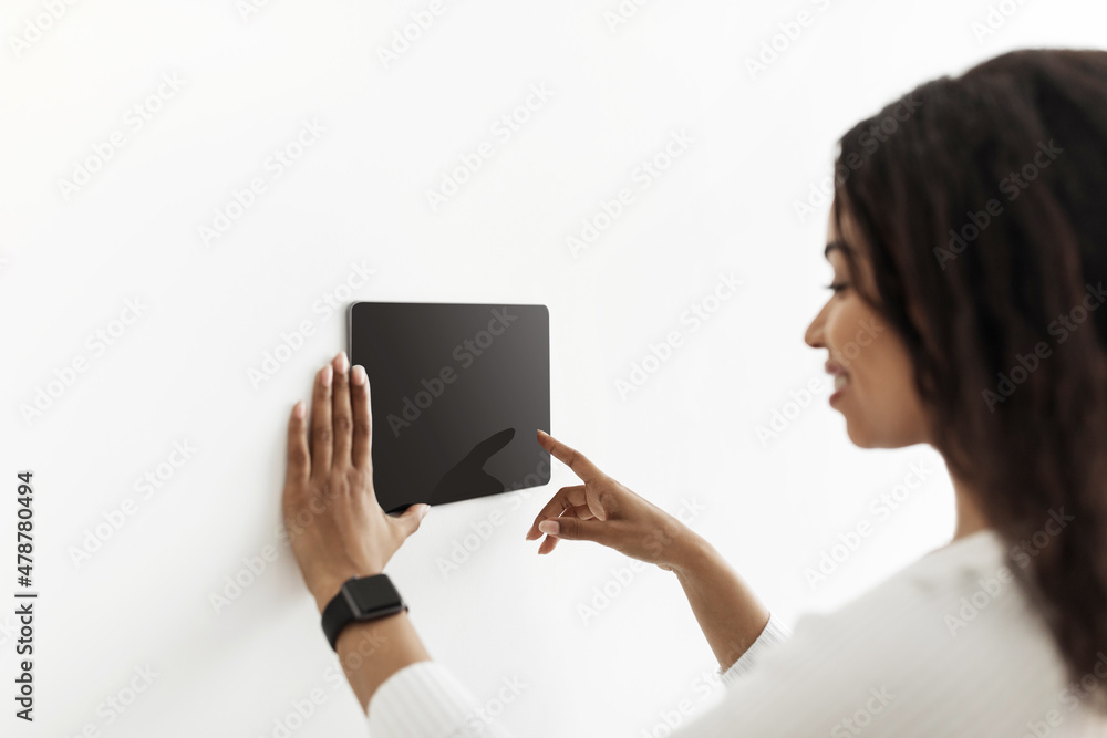 Poster innovative technology. african american lady using digital tablet with blank screen with smart home 