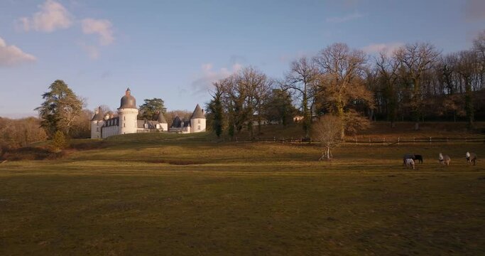 Aerial shot of the castle of the Gu&eacute; P&eacute;an by sunset in Monthou-sur-Cher, next to the Loire Valley, in France.