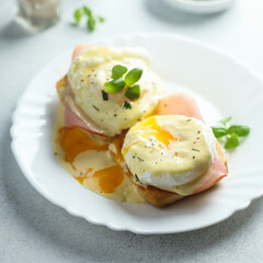 Traditional homemade Benedict eggs with ham