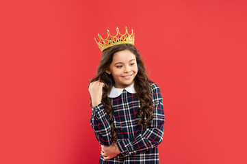 proud kid with curly hair. egoistic teen girl wear diadem. arrogance and selfishness.