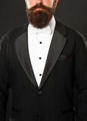 cropped bearded businessman in tuxedo on black background, formalwear