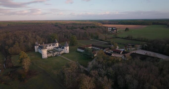 Aerial shot of the castle and stable of the Gu&eacute; P&eacute;an by sunset in Monthou-sur-Cher, next to the Loire Valley, in France.