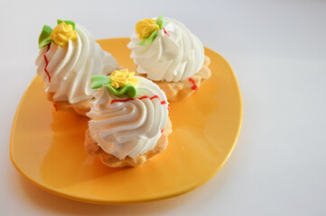 shortbread cake with cream on a yellow plate. sweet dessert for tea and coffee.