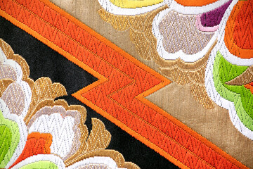 Japanese vintage textile, obi close-up with floral motif. Close-up of elegant and splendid fabric...