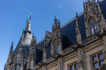 Fototapeta na wymiar Top of gothic church with decorations in small town