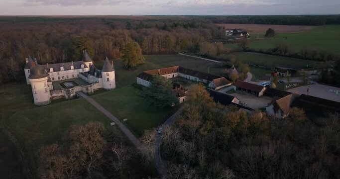 Aerial shot of the castle and stable of the Gu&eacute; P&eacute;an by sunset in Monthou-sur-Cher, next to the Loire Valley, in France.