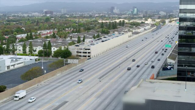 Aerial Panning Over The 405 North Highway With Light Traffic And City Haze On The Horizon - Los Angeles, California
