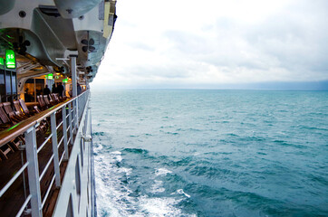 Promenade boat deck view of Cunard luxury ocean liner Queen Mary 2 cruise ship QM2 on passage...