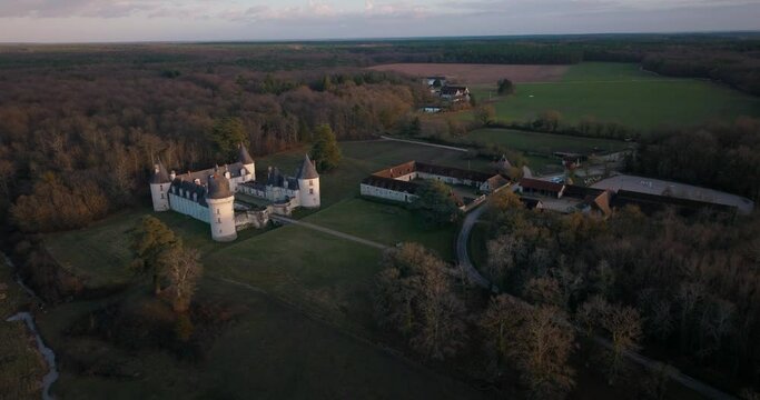 Aerial shot of the castle and stable of the Gu&eacute; P&eacute;an by sunset in Monthou-sur-Cher, next to the Loire Valley, in France.
