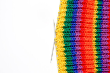 Knitted fabric made of multicolored (red, orange, yellow, green, blue, purple) woolen threads on...