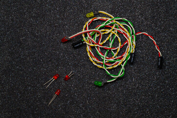 multicolored wires with diodes on a dark background - obrazy, fototapety, plakaty