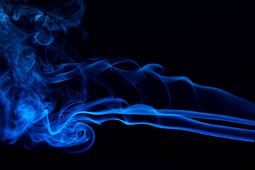 Fototapeta premium Abstract colored smoke hookah on dark background. Texture. Art Design element. Personal vaporizers fragrant steam. Concept of alternative non-nicotine smoking. E-cigarette. Blurry image, soft focus
