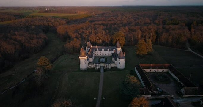 Aerial shot of the castle of the Gu&eacute; P&eacute;an by sunset in Monthou-sur-Cher, next to the Loire Valley, in France.