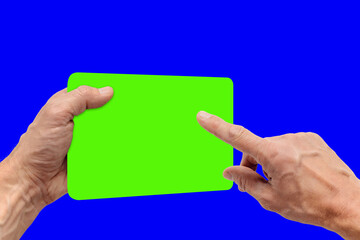 Closeup photo of young man using tablet with chroma key screen, hand of a young man with protruding veins, the device is positioned slightly turned