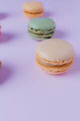 Macarons dessert on pastel tones background. Copy space.