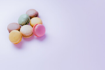 Macarons dessert on pastel tones background. Copy space.