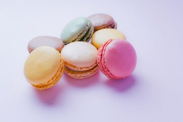 Macarons dessert on pastel tones background. Copy space.