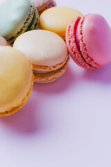 Macarons dessert on pastel tones background. Copy space.
