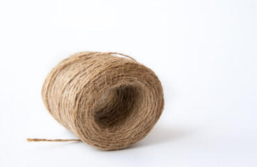 Hank of Twine close-up on white background Rope coil skein of linen string, cord Natural Jute Twine