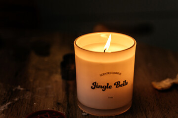 Christmas candle burning on the kitchen table