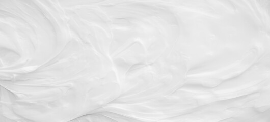White surface of the cream lotion softens the background.