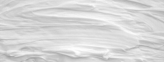 White surface of the cream lotion softens the background.