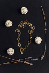 Fototapeta na wymiar Gold chain natural mixed pink rose quartz necklace. On a black background