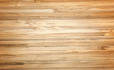 Background with wood texture. Top view of a wooden table Brown treated wood with an abstract pattern. Bamboo.