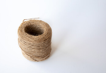 Tangled Thread. Hank of Twine close-up on white background Rope Coil Skein of Linen String, Cord Natural Jute Twine Copy Space