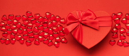 Valentine's Day banner with red hearts and festive box. Flat lay, copy space